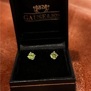 Small peridot stud earrings. 14k white gold